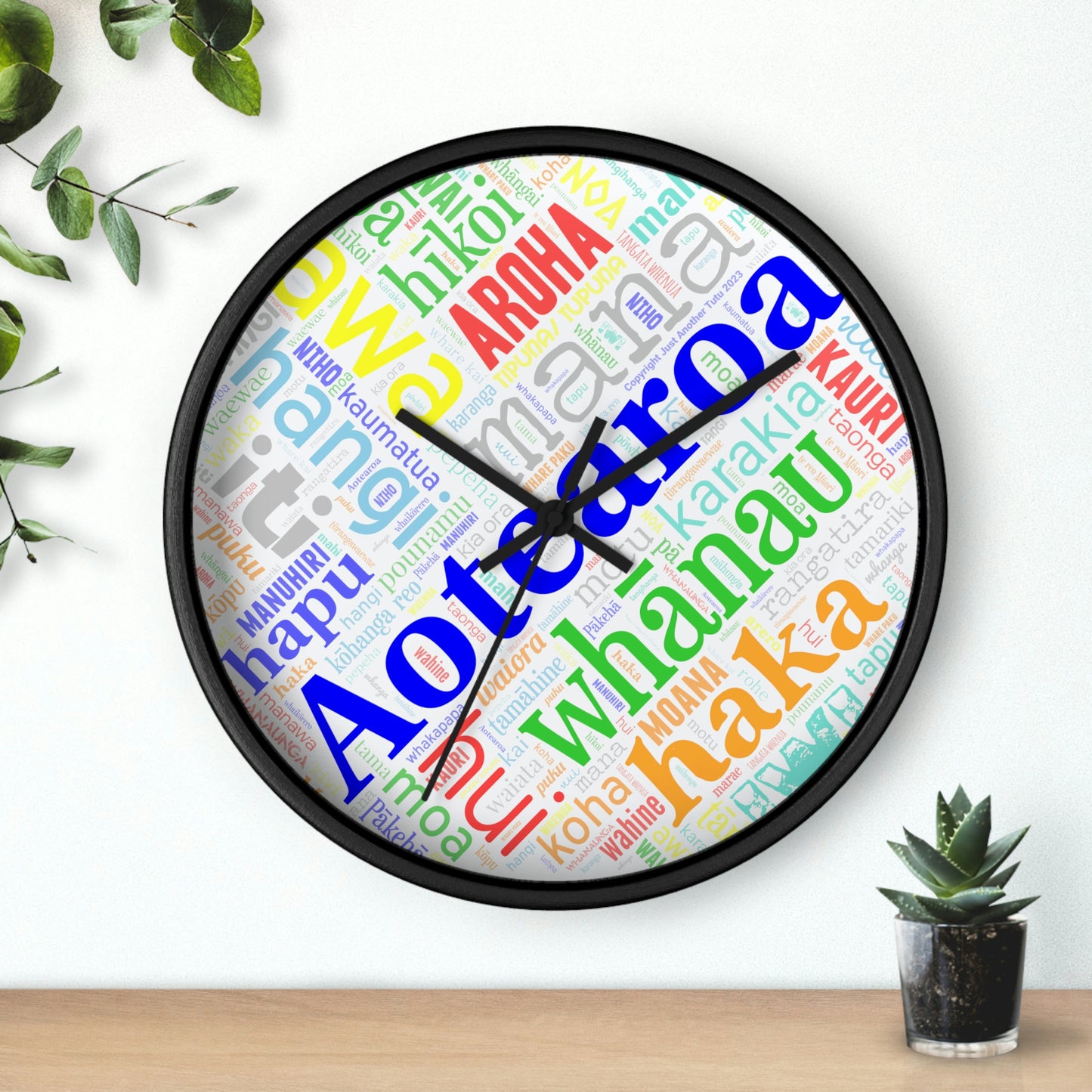 Rainbow Māori Word Art Heart Wall clock